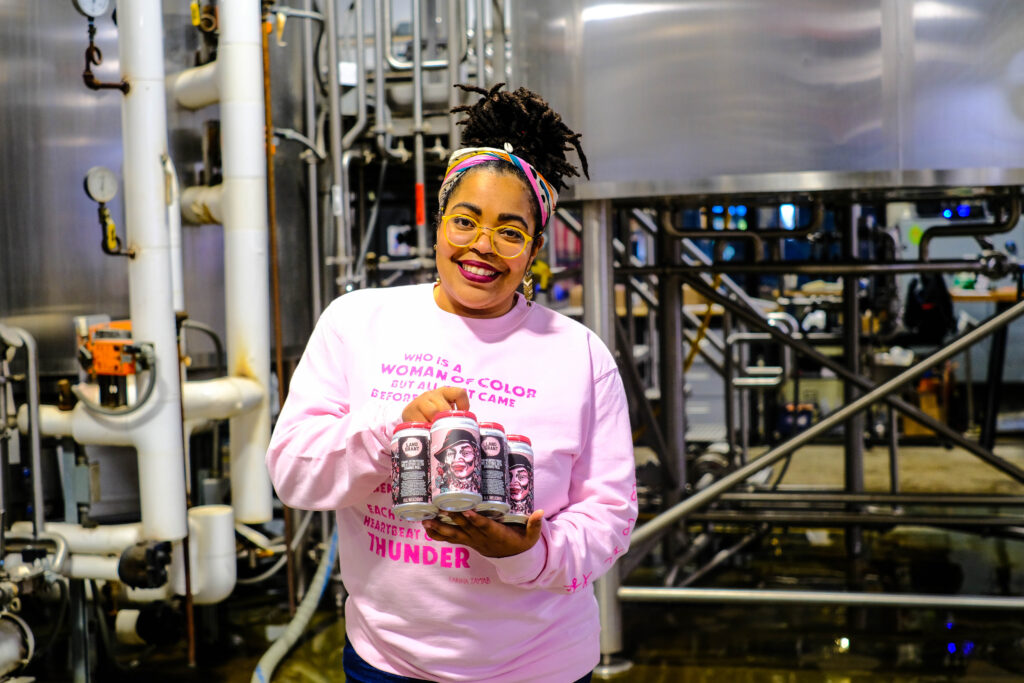 Photo of woman holding beer